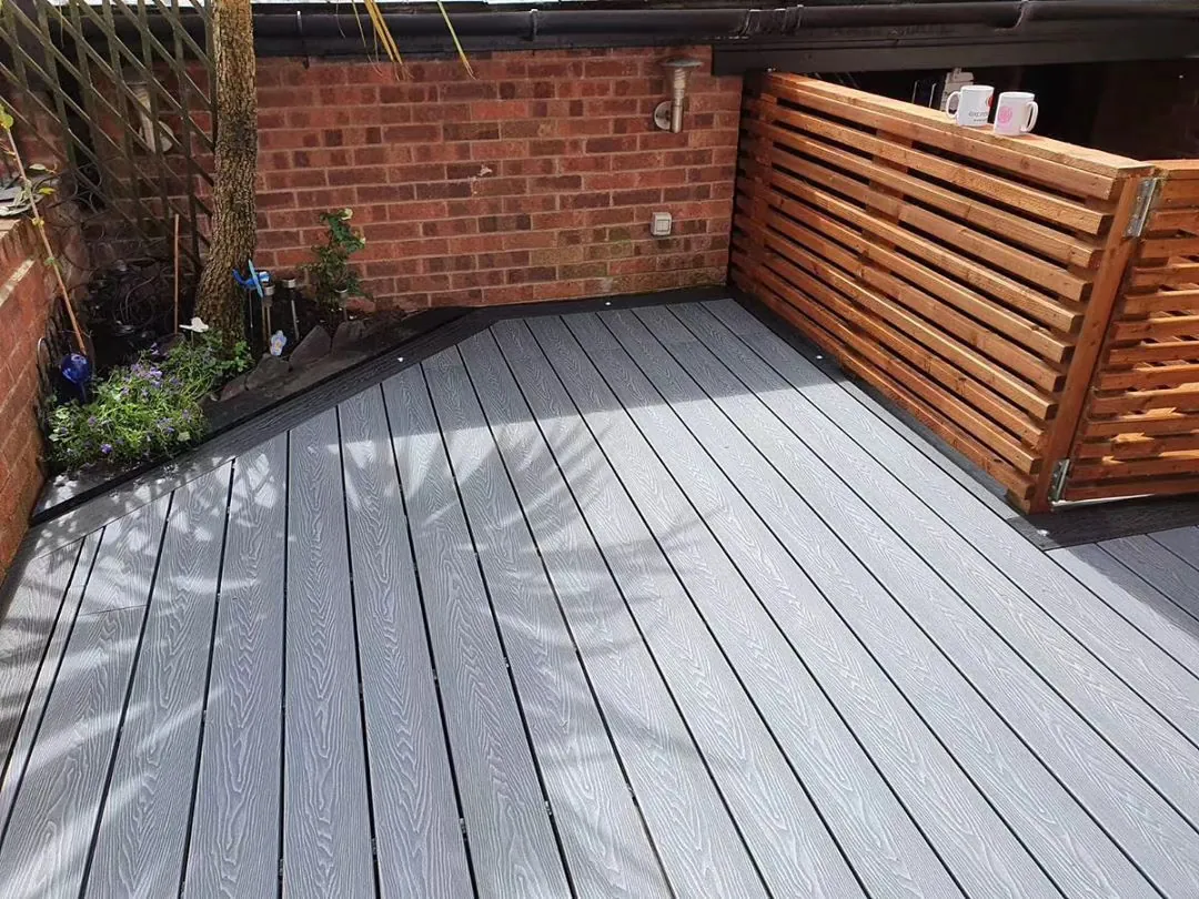 Grey 3D embossed decking installed in a courtyard