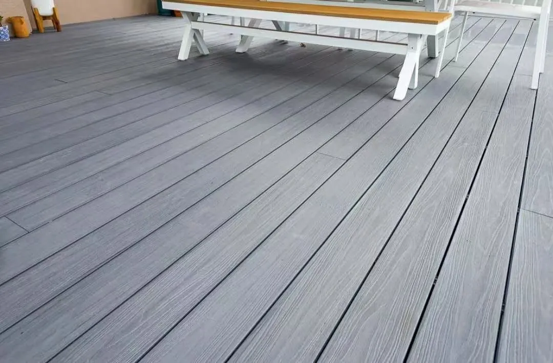 Grey co-extruded decking installed under outdoor seating